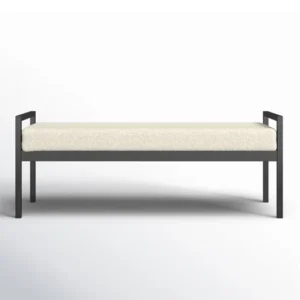 Modern bench with black frame and beige cushion, isolated on white background.