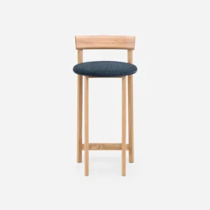 Wooden bar stool with blue cushioned seat and backrest against a white background.