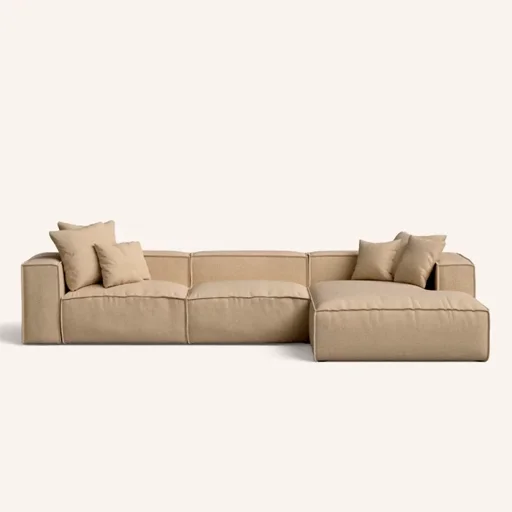 A beige modular sofa with two sections and several cushions, set against a plain background