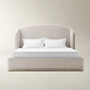Light beige upholstered bed with curved headboard, wooden base accent, and minimalist styling.